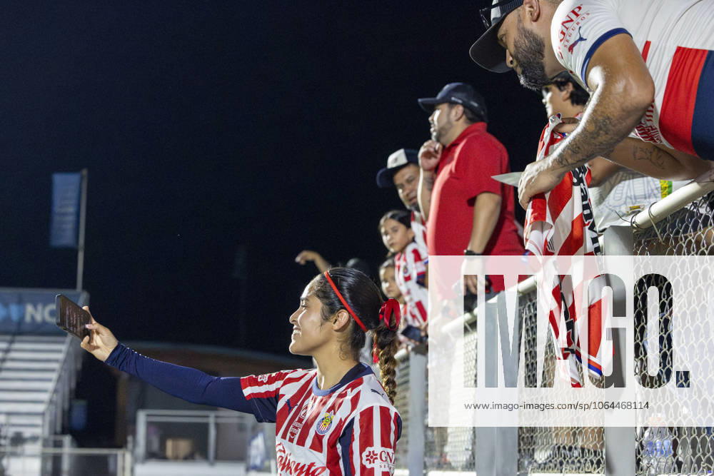 Guadalajara forward JOSELINE MONTOYA (25) takes a picture with a fanâ€⠢s camera following the International Exhibition game between Mexicoâ€⠢s Chivas De Guadalajara and the NC Courage at First Horizon Stadium in Cary, North Carolina. NC Courage defeated the Chivas de Guadalajara 4-0. Cary USA - ZUMAa220 20250725_znp_a220_063