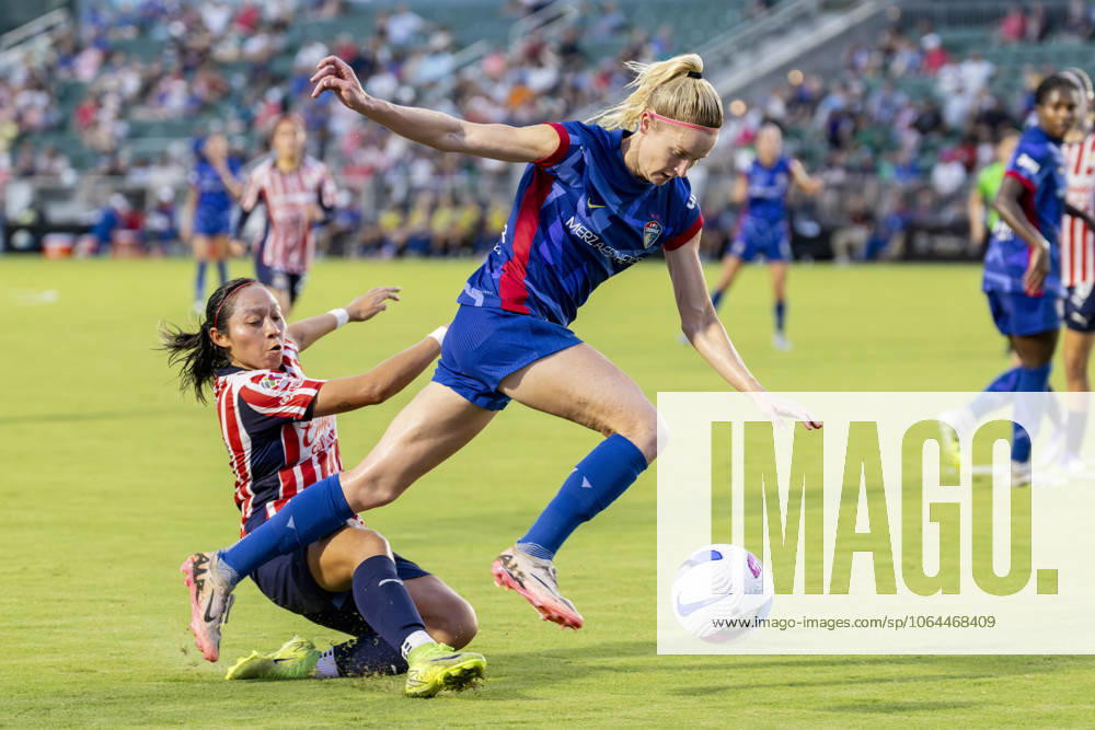 Guadalajara forward VIRIDIANA SALAZAR (30) kicks the ball away from North Carolina Courage midfielder DANI WEATHERHOLT (17) during the first half of the International Exhibition game between Mexicoâ€⠢s Chivas De Guadalajara and the NC Courage at First Horizon Stadium in Cary, North Carolina. NC Courage defeated the Chivas de Guadalajara 4-0. Cary USA - ZUMAa220 20250725_znp_a220_070
