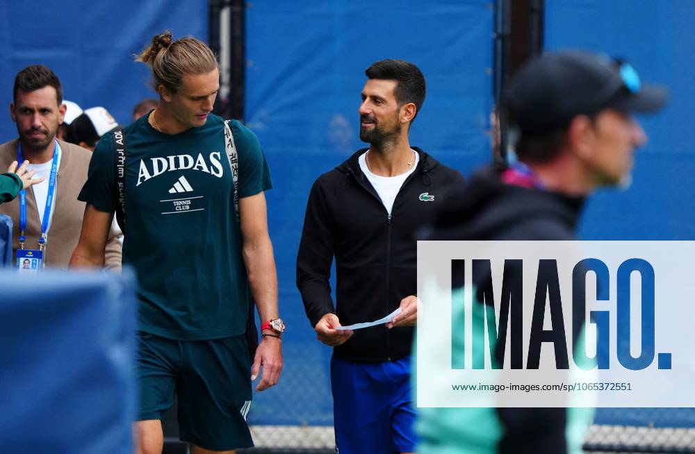 Alexander Zverev is shown a piece of paper by Novak Djokovic 2025 US Open, Thursday Previews, USTA Billie Jean King National Tennis Center, New York, USA - 21 Aug 2025New York Flushing Meadows