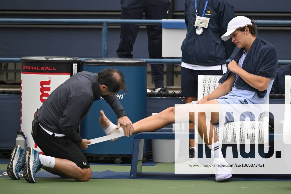Alexander Blockx of Belgium receives medical attention after suffering an ankle injuring during a tennis match between Belgian Blockx and Belgian Coppejans, in the second round of the qualifications for the men s signles of the 2025 US Open Grand Slam tennis tournament in New York City, USA, Thursday 21 August 2025. TONYxBEHAR x131793844x