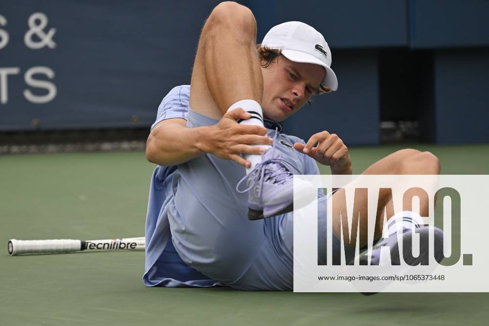 Alexander Blockx of Belgium holds his leg as lays on the tennis court after suffering an injuring during a tennis match between Belgian Blockx and Belgian Coppejans, in the second round of the qualifications for the men s signles of the 2025 US Open Grand Slam tennis tournament in New York City, USA, Thursday 21 August 2025. TONYxBEHAR x131793849x