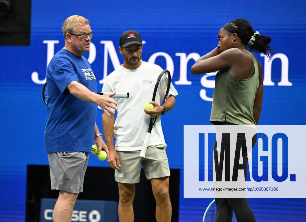 FLUSHING NY- AUGUST 21: Coco Gauff is seen on the practice court with her coach Jean-Christophe Faurel and Gavin MacMillan on Arthur Ashe Stadium at the USTA Billie Jean King National Tennis Center on August 21, 2025 in Flushing Queens.