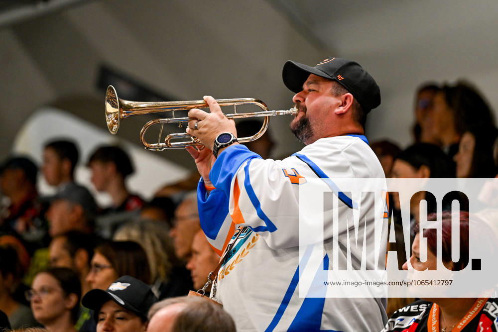 Eishalle Linz, AUT, ice hockey preparation test match, Black Wings Linz AUT vs HK Nitra SVK , in the picture a fan of the Black Wings Linz with a trumpet Linz Oberoesterreich Austria