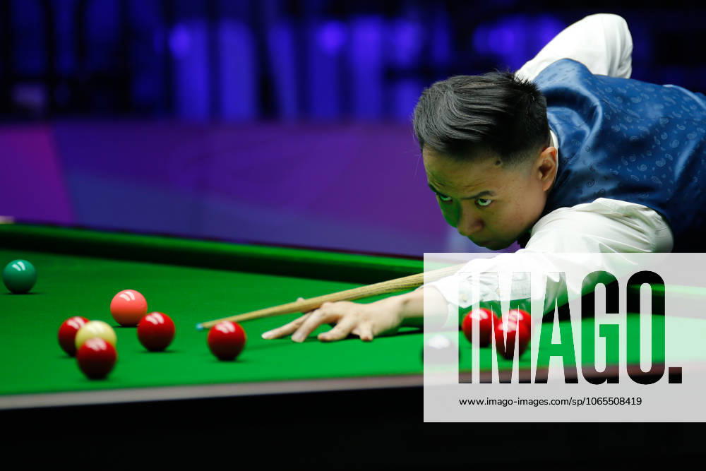Xiao Guodong of China plays a shot in the first round match against Mink Nutcharut of Thailand on day 1 of the 2025 Wuhan Open Qualifiers at Optics Valley Gymnasium of HUST on August 24, 2025 in Wuhan, Hubei Province of China.