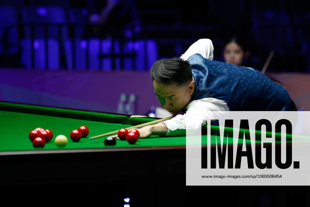 Xiao Guodong of China plays a shot in the first round match against Mink Nutcharut of Thailand on day 1 of the 2025 Wuhan Open Qualifiers at Optics Valley Gymnasium of HUST on August 24, 2025 in Wuhan, Hubei Province of China.