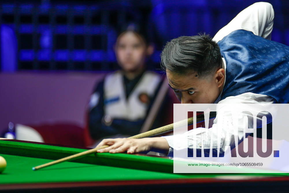 Xiao Guodong of China plays a shot in the first round match against Mink Nutcharut of Thailand on day 1 of the 2025 Wuhan Open Qualifiers at Optics Valley Gymnasium of HUST on August 24, 2025 in Wuhan, Hubei Province of China.