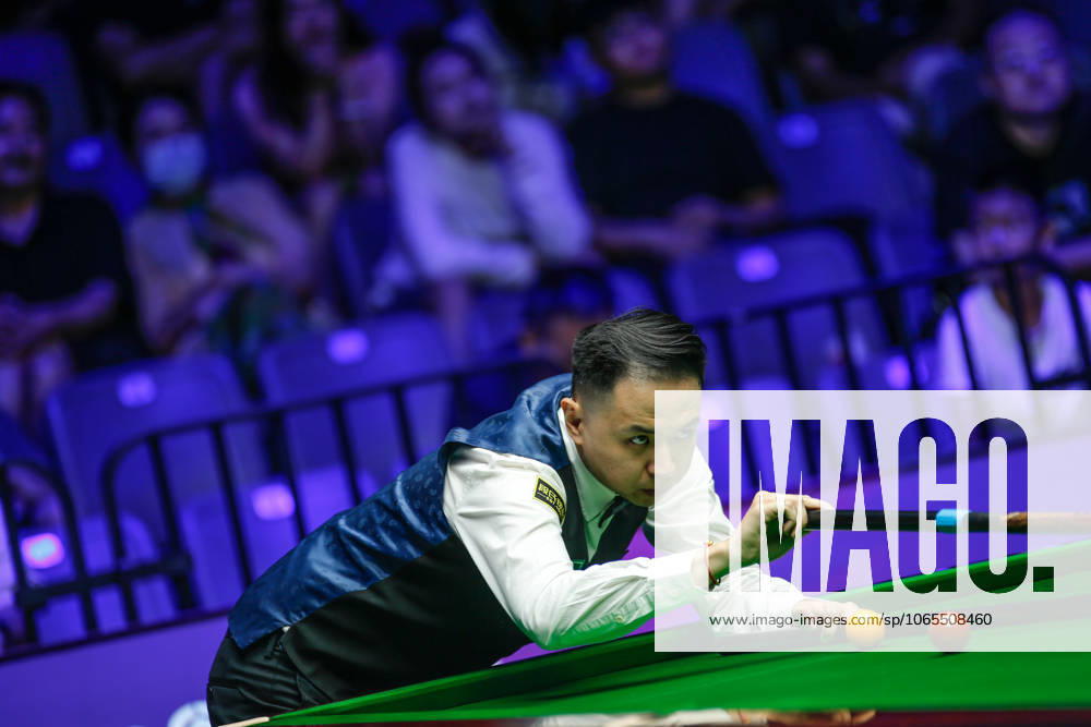 Xiao Guodong of China plays a shot in the first round match against Mink Nutcharut of Thailand on day 1 of the 2025 Wuhan Open Qualifiers at Optics Valley Gymnasium of HUST on August 24, 2025 in Wuhan, Hubei Province of China.