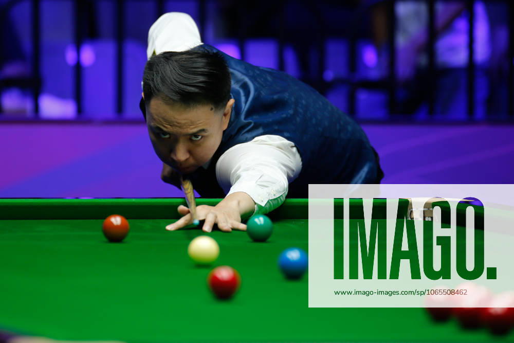 Xiao Guodong of China plays a shot in the first round match against Mink Nutcharut of Thailand on day 1 of the 2025 Wuhan Open Qualifiers at Optics Valley Gymnasium of HUST on August 24, 2025 in Wuhan, Hubei Province of China.