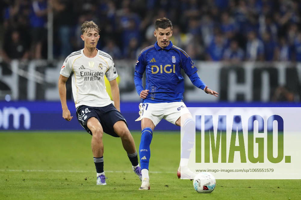 Real Oviedo v Real Madrid CF - LaLiga EA Sports Luka Ilic attacking midfield of Oviedo and Serbia and Dean Huijsen centre-back of Real Madrid and Spain compete for the ball during the La Liga EA Sports match between Real Oviedo and Real Madrid CF at Carlos Tartiere on August 24, 2025 in Oviedo, Spain. Oviedo Spain