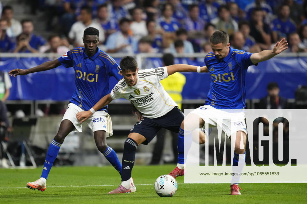 Real Oviedo v Real Madrid CF - LaLiga EA Sports Arda Guler attacking midfield of Real Madrid and Turkey and Leander Dendoncker defensive midfield of Oviedo and Belgium compete for the ball during the La Liga EA Sports match between Real Oviedo and Real Madrid CF at Carlos Tartiere on August 24, 2025 in Oviedo, Spain. Oviedo Spain