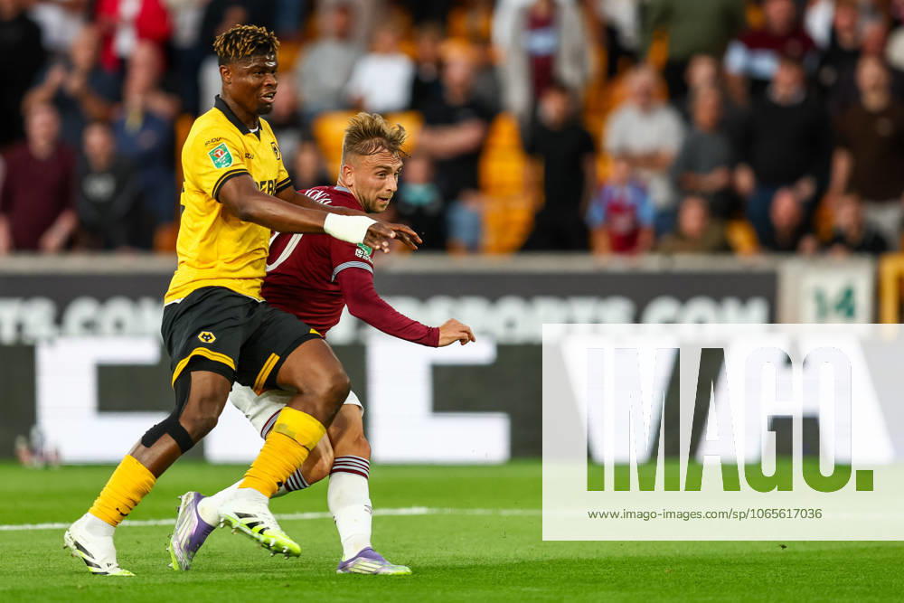 Wolverhampton Wanderers v West Ham United - Carabao Cup Second Round West Ham s Jarrod Bowen attempts a shot under pressure from Wolverhampton Wanderers Emmanuel Agbadou during the Carabao Cup match between Wolverhampton Wanderers and West Ham United at Molineux in Wolverhampton, England, on August 26, 2025. Wolverhampton West Midlands United Kingdom