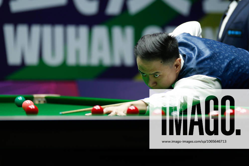 Xiao Guodong of China plays a shot in the Quarterfinal match against Stan Moody of England on day 5 of the 2025 Wuhan Open at Optics Valley Gymnasium of HUST on August 28, 2025 in Wuhan, Hubei Province of China.