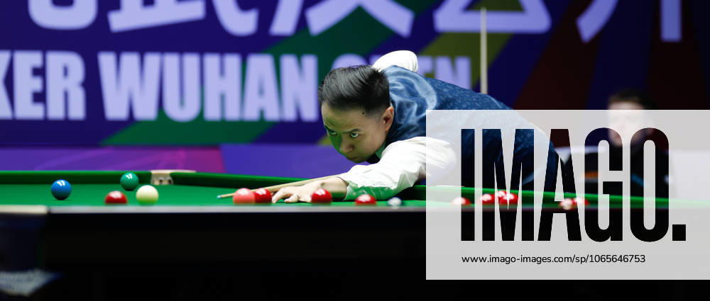 Xiao Guodong of China plays a shot in the Quarterfinal match against Stan Moody of England on day 5 of the 2025 Wuhan Open at Optics Valley Gymnasium of HUST on August 28, 2025 in Wuhan, Hubei Province of China.