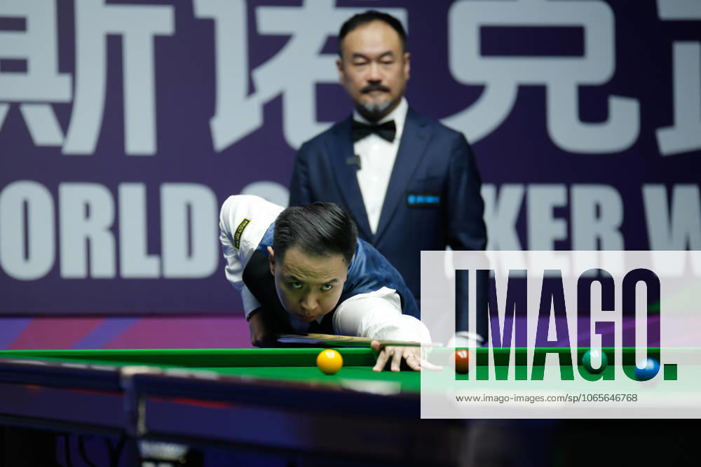 Xiao Guodong of China plays a shot in the Quarterfinal match against Stan Moody of England on day 5 of the 2025 Wuhan Open at Optics Valley Gymnasium of HUST on August 28, 2025 in Wuhan, Hubei Province of China.