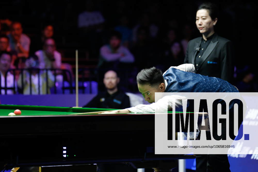 Xiao Guodong of China plays a shot in the Final match against Gary Wilson of England on day 7 of the 2025 Wuhan Open at Optics Valley Gymnasium of HUST on August 30, 2025 in Wuhan, Hubei Province of China.