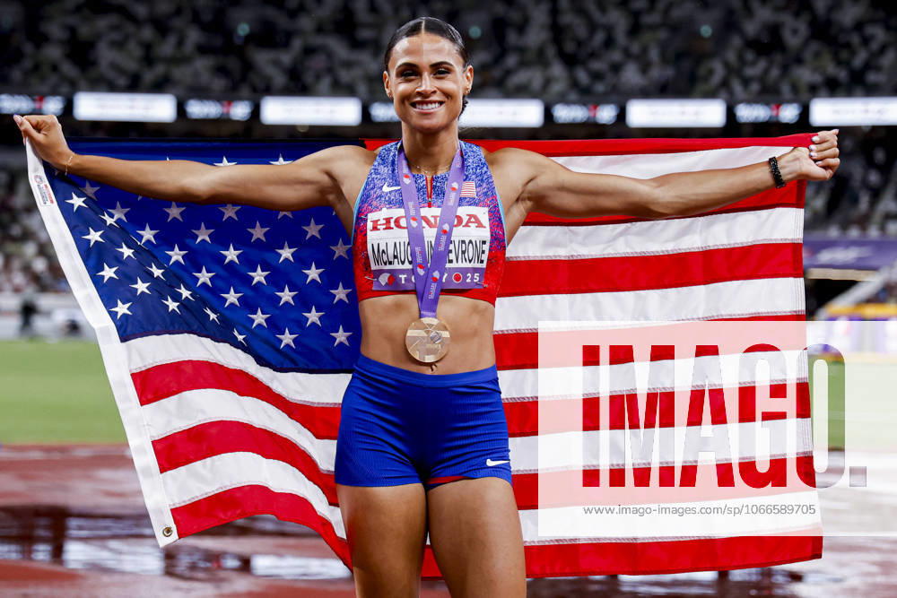 Winner Sydney Mclaughlin Levrone of United States of America showing her gold medal and celebrating and holding flag after competing in the Women s 400 Metres Final during World Athletics Championships Tokyo 2025 of the Day 6 at Japan National Stadium on September 18, 2025 in Tokyo, Japan Photo by Marcel ter Bals DeFodi Images