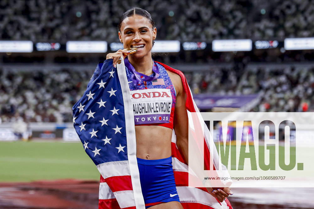 Winner Sydney Mclaughlin Levrone of United States of America showing her gold medal and celebrating and holding flag after competing in the Women s 400 Metres Final during World Athletics Championships Tokyo 2025 of the Day 6 at Japan National Stadium on September 18, 2025 in Tokyo, Japan Photo by Marcel ter Bals DeFodi Images