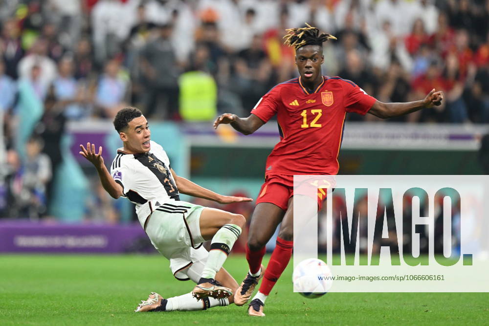 Spain v Germany: FIFA World Cup, WM, Weltmeisterschaft, Fussball 2022 AL KHOR, QATAR - NOVEMBER 27: Jamal Musiala (L) of Germany in action against Nico Williams 12 of Spain during the FIFA World Cup Qatar 2022 Group E match between Spain and Germany at Al Bayt Stadium on November 27, 2022 in Al Khor, Qatar. Al Khawr Qatar. Editorial use only. Please get in touch for any other usage.