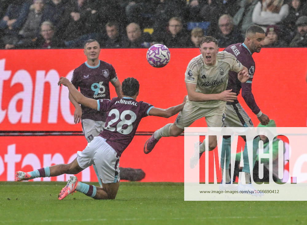 20th September 2025; Turf Moor, Burnley, Lancashire, England; Premier League Football, Burnley versus Nottingham Forest; Elliot Anderson of Nottingham Forest an Hannibal Mejbri of Burnley clash and fall to the pitch LeexDurkin