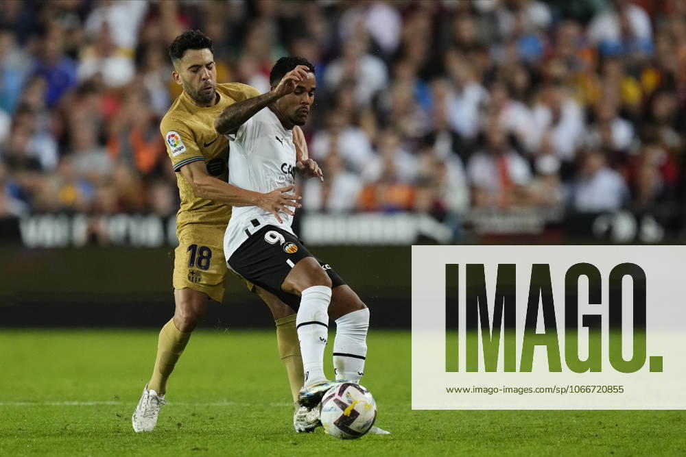Valencia CF v FC Barcelona, Barca - LaLiga Santander VALENCIA, SPAIN - 29 October: Jordi Alba left-back of Barcelona and Spain and Justin Kluivert Left Winger of Valencia and Netherlands compete for the ball during the La Liga Santander match between Valencia CF and FC Barcelona at Estadio Mestalla on October 29, 2022 in Valencia, Spain. Spain World. Editorial use only. Please get in touch for any other usage.