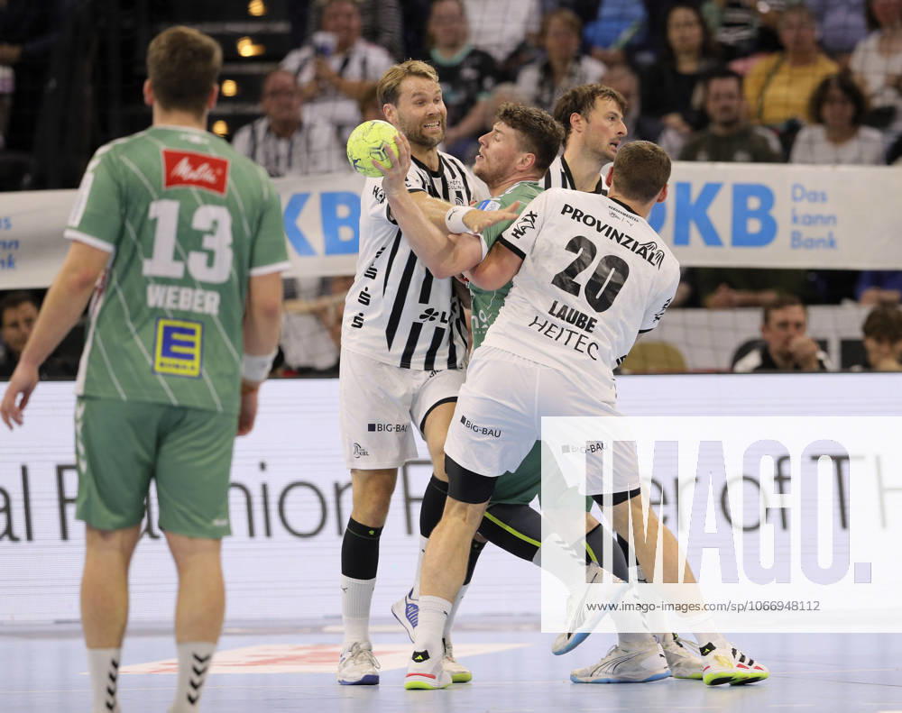 Photo on the ball Philipp Vorlicek Minden against Lukas LAUBE Kiel and left Petter Overby Kiel Handball Men 1 Bundesliga on Thu 25 09 2025 THW Kiel GWD Minden