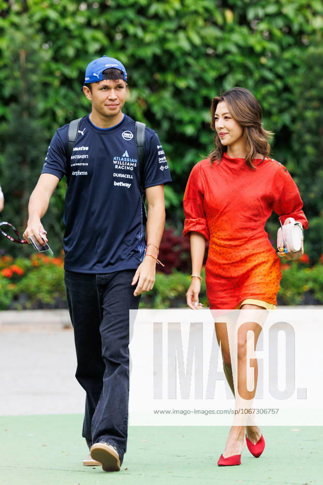 Alexander Albon of Thailand and the Williams Racing Team (L) and his partner Muni He (R) in the paddock ahead of the F1 Grand Prix of Singapore at the Marina Bay Street Circuit. Singapore Singapore - ZUMAs197 20251003_aaa_s197_173