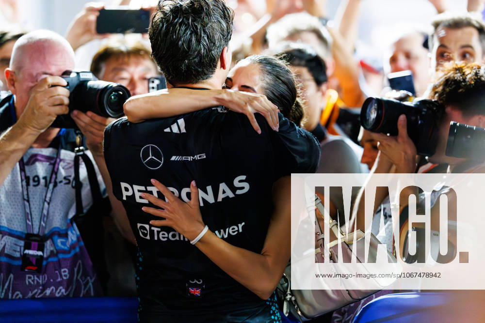 Formula 1, Singapore Grand Prix 2025, Sunday Race, Singapore - 05 Oct 2025 George Russell of Great Britain and the Mercedes-AMG PETRONAS Formula One Team celebrates with his partner Carmen Montero Mundt after winning the Grand Prix of Singapore at the Marina Bay Street Circuit. Singapore Singapore