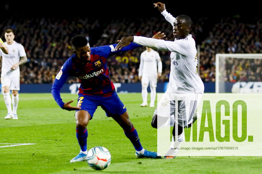 FC Barcelona, Barca v Real Madrid: La Liga BARCELONA, SPAIN - DEC 18: Barcelona s Portuguese defender Nelson Semedo (L) vies with Real Madrid s French midfielder Ferland Mendy (R) during Spanish El Clasico football match between FC Barcelona and Real Madrid at the Camp Nou stadium in Barcelona on December 18, 2019. Spain World. Editorial use only. Please get in touch for any other usage.