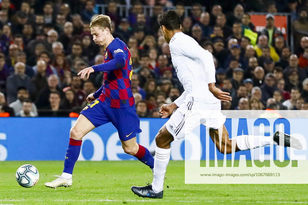 FC Barcelona, Barca v Real Madrid: La Liga BARCELONA, SPAIN - DECEMBER 18: Barcelona s Dutch midfielder Frekie De Jong (L) vies with Real Madrid s French defender Raphael Varane (R) during Spanish El Clasico football match between FC Barcelona and Real Madrid at the Camp Nou stadium in Barcelona on December 18, 2019. Catalonia Spain. Editorial use only. Please get in touch for any other usage.