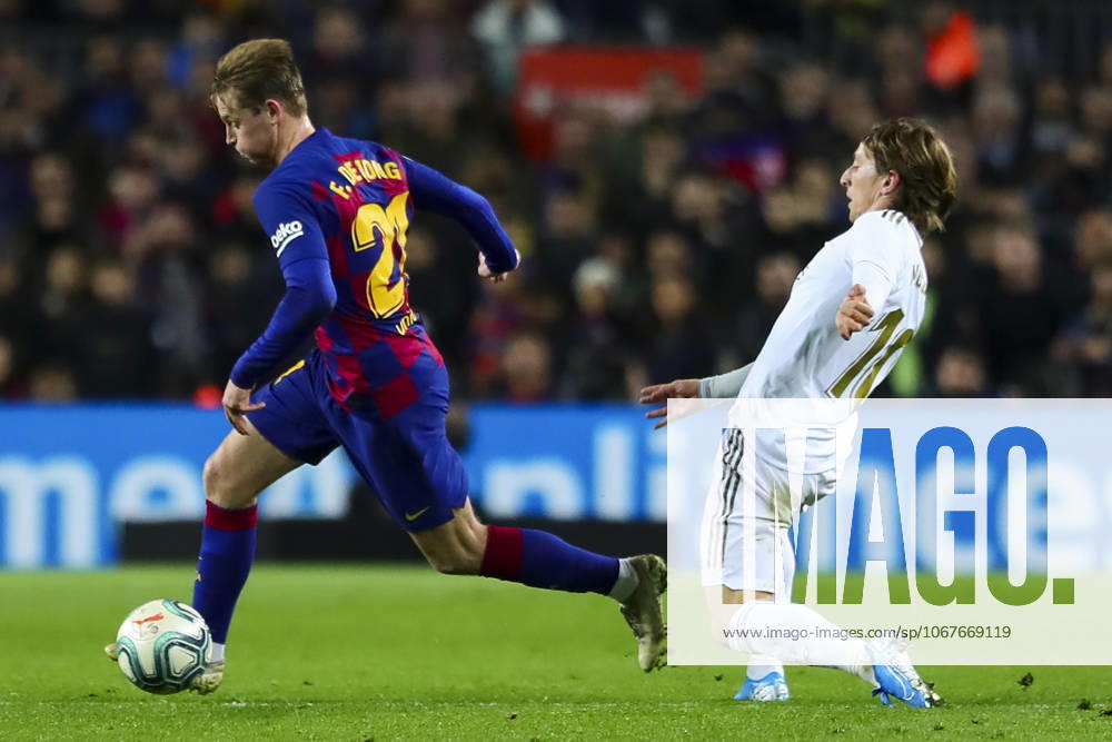FC Barcelona, Barca v Real Madrid: La Liga BARCELONA, SPAIN - DECEMBER 18: Barcelona s Dutch midfielder Frekie De Jong (L) vies with Real Madrid s Croatia s midfielder Luka Modric (R) during Spanish El Clasico football match between FC Barcelona and Real Madrid at the Camp Nou stadium in Barcelona on December 18, 2019. Catalonia Spain. Editorial use only. Please get in touch for any other usage.