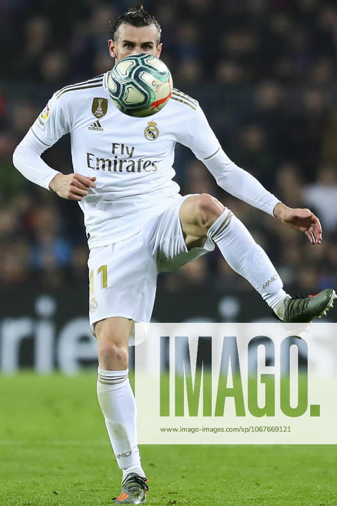 FC Barcelona, Barca v Real Madrid: La Liga BARCELONA, SPAIN - DECEMBER 18: Real Madrid s Welsh forward Gareth Bale vies during Spanish El Clasico football match between FC Barcelona and Real Madrid at the Camp Nou stadium in Barcelona on December 18, 2019. Catalonia Spain. Editorial use only. Please get in touch for any other usage.