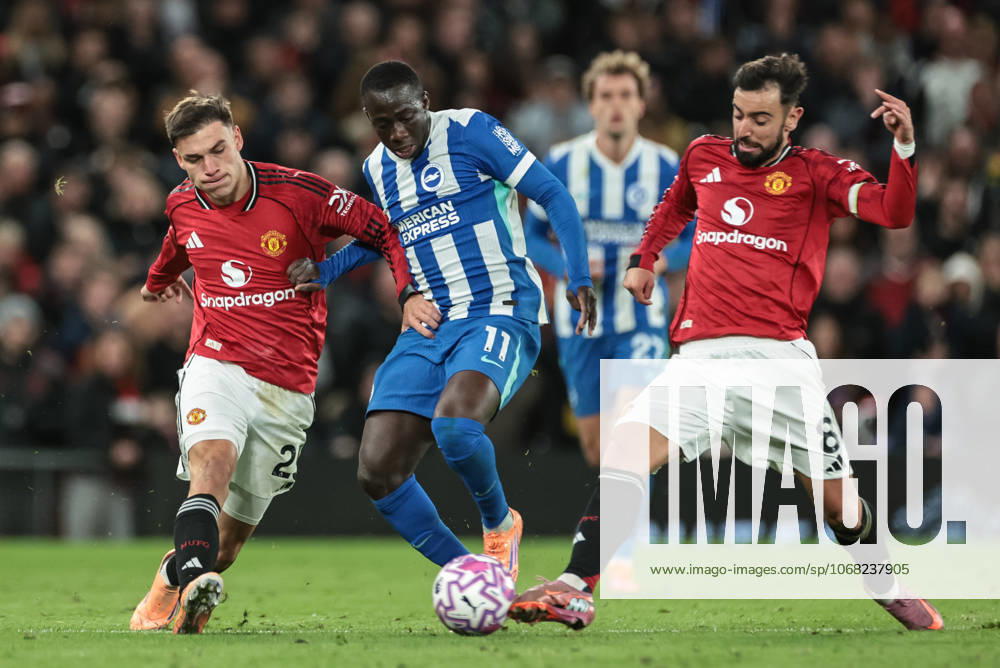 Premier League Manchester United, ManU v Brighton and Hove Albion Yankuba Minteh of Brighton & Hove Albion is tackled by Bruno Fernandes of Manchester United and pressured by Manuel Ugarte of Manchester United during the Premier League match Manchester United vs Brighton and Hove Albion at Old Trafford, Manchester, United Kingdom, 25th October 2025 (Photo by Mark Cosgrove News Images) Manchester Old Trafford Greater Manchester United Kingdom
