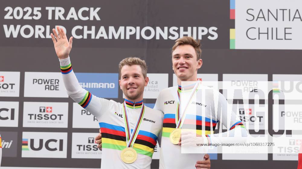 Belgian Fabio Van Den Bossche and Belgian Lindsay De Vylder celebrate celebrate on the podium with their gold medals and wearing the world champion jersey, on the podium of the final of the men s Madison race at the 2025 UCI Track World Championships cycling, in Santiago, Chile, Sunday 26 October 2025. The Track World Championships take place from 22 to 26 October at the Velodromo de Penalolen in Santiago, Chile. BENOITxDOPPAGNE x138051395x