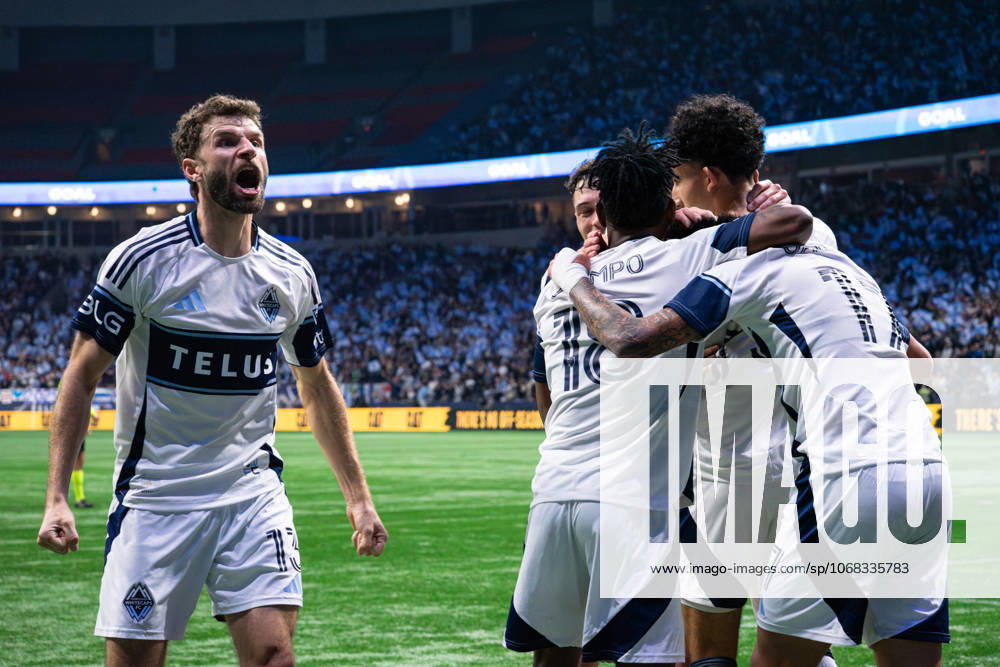 Thomas Muller (13 Vancouver Whitecaps FC) yells and reacts and teammates celebrate and hug Kenji Cabrera (17 Vancouver Whitecaps FC) after scoring a goal during Game 1 of the Major League Soccer Round One Playoffs Series between Vancouver Whitecaps FC and FC Dallas at BC Place Stadium in Vancouver, British Columbia, Canada (EDITORIAL USAGE ONLY).