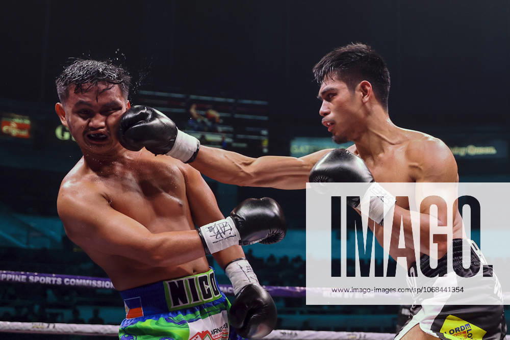 (251029) -- QUEZON CITY, Oct. 29, 2025 -- Eman Bacosa (R) of the Philippines competes against Nico Salado of the Philippines during the lightweight match at the Thrilla in Manila: 50th Anniversary in Quezon City, the Philippines on Oct. 29, 2025. ) (SP)PHILIPPINES-QUEZON CITY-BOXING-THRILLA IN MANILA 50TH ANNIVERSARY RouellexUmali