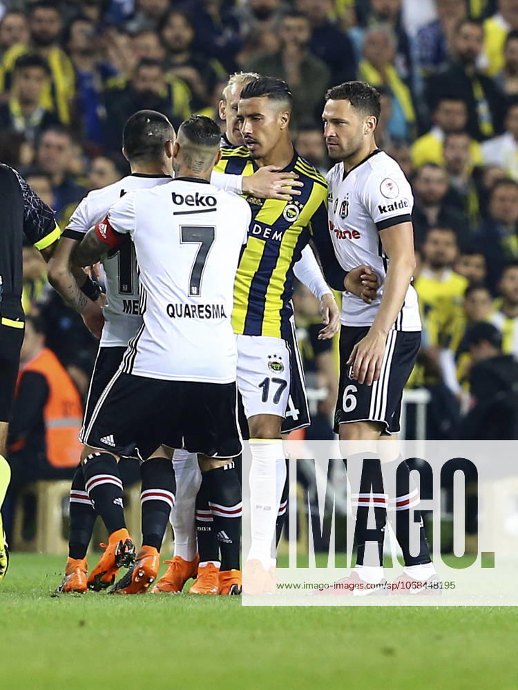 Fenerbahce v Besiktas: Ziraat Turkish Cup ISTANBUL, TURKEY - APRIL 19: Medel (L) of Besiktas argues with Nabil Dirar (17) of Fenerbahce during Ziraat Turkish Cup Semi Final second leg soccer match between Fenerbahce and Besiktas at the Ulker Stadium in Istanbul, Turkey on April 19, 2018. The match was cancelled after the latest incidents. Istanbul Turkey. Editorial use only. Please get in touch for any other usage.