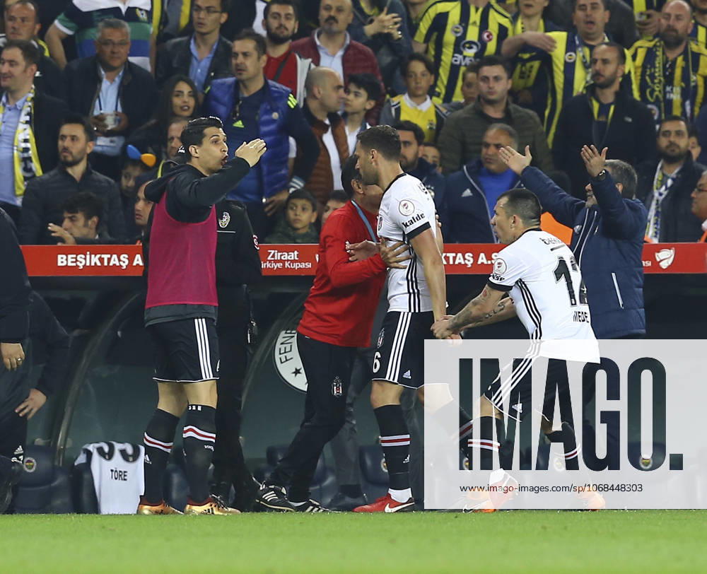 Fenerbahce v Besiktas: Ziraat Turkish Cup ISTANBUL, TURKEY - APRIL 19: Medel (R) of Besiktas tries to calm his teammate Dusko Tosic (2nd R) down during Ziraat Turkish Cup Semi Final second leg soccer match between Fenerbahce and Besiktas at the Ulker Stadium in Istanbul, Turkey on April 19, 2018. The match was cancelled after the latest incidents. Istanbul Turkey. Editorial use only. Please get in touch for any other usage.
