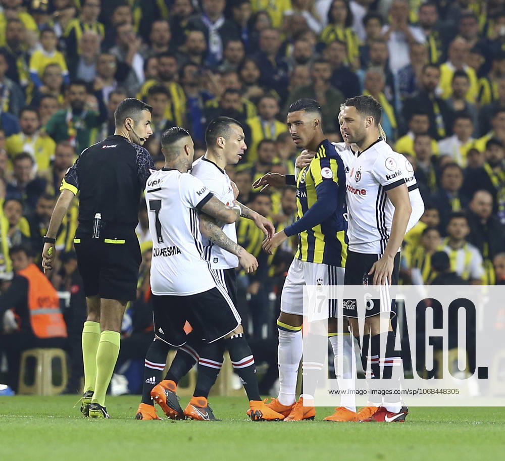 Fenerbahce v Besiktas: Ziraat Turkish Cup ISTANBUL, TURKEY - APRIL 19: Medel (C) of Besiktas argues with Nabil Dirar (2nd R) of Fenerbahce during Ziraat Turkish Cup Semi Final second leg soccer match between Fenerbahce and Besiktas at the Ulker Stadium in Istanbul, Turkey on April 19, 2018. The match was cancelled after the latest incidents. Istanbul Turkey. Editorial use only. Please get in touch for any other usage.