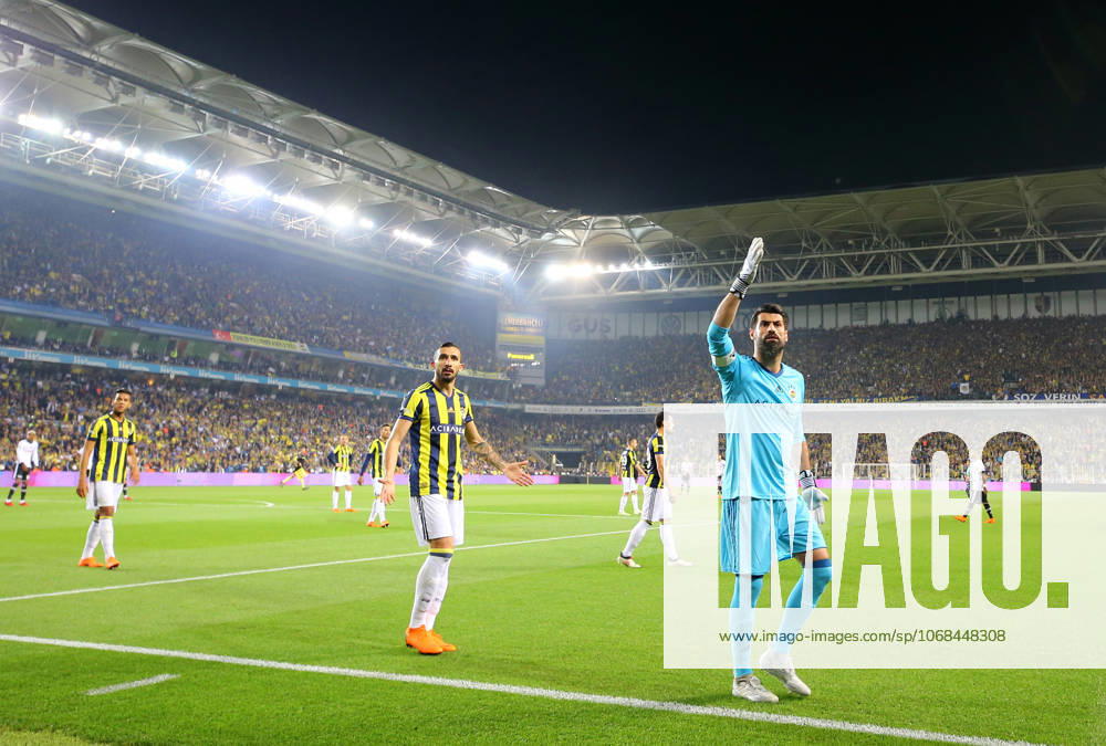 Fenerbahce v Besiktas: Ziraat Turkish Cup ISTANBUL, TURKEY - APRIL 19: Mehmet Topal (2nd R) and Volkan Demirel (R) of Fenerbahce warn the fans after they throw objects to pitch during Ziraat Turkish Cup Semi Final second leg soccer match between Fenerbahce and Besiktas at the Ulker Stadium in Istanbul, Turkey on April 19, 2018. The match was cancelled after the latest incidents. Istanbul Turkey. Editorial use only. Please get in touch for any other usage.
