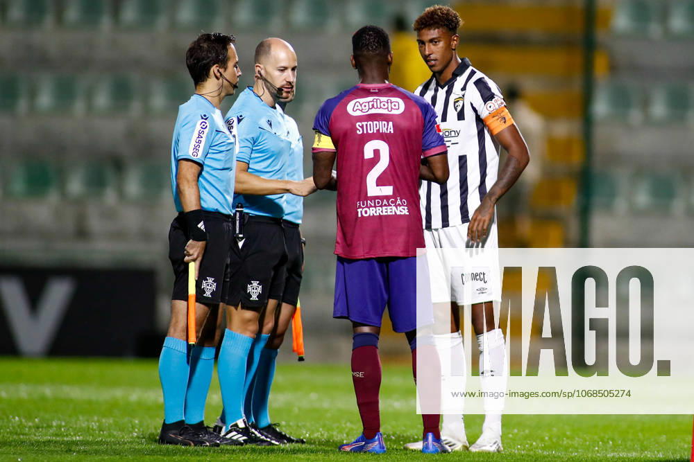 Liga Portugal 2: Portimonense - Torreense Portimao, Portugal - 30 10 2025: Liga Portugal 2 Meu Super 9th round match between SC Portimonense and SCU Torreense at Estadio Municipal de Portimao 9 Portimonense attacker, Tamble Ulisses Folgado Monteiro and 2 Torreense defender, Stopira with referee at cointoss before kick-off Mandatory Credit: Toby Tande Avant Sports Agency Portimao Estadio Municipal de Portimao Portugal