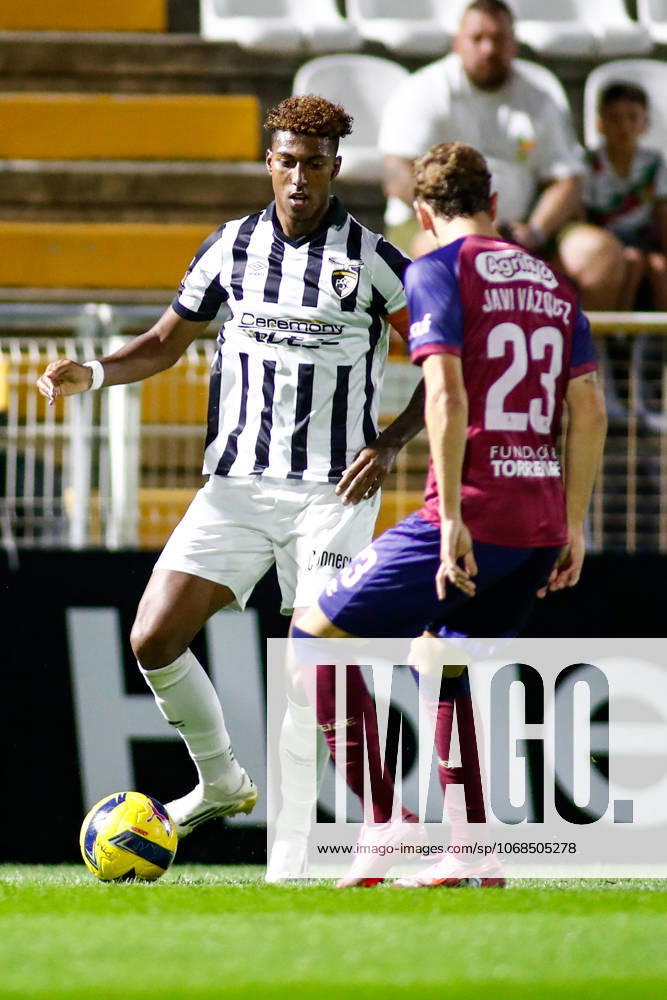 Liga Portugal 2: Portimonense - Torreense Portimao, Portugal - 30 10 2025: Liga Portugal 2 Meu Super 9th round match between SC Portimonense and SCU Torreense at Estadio Municipal de Portimao 9 Portimonense attacker, Tamble Ulisses Folgado Monteiro with the ball taking on 23 Torreense defender, Javi Vazquez Mandatory Credit: Toby Tande Avant Sports Agency Portimao Estadio Municipal de Portimao Portugal