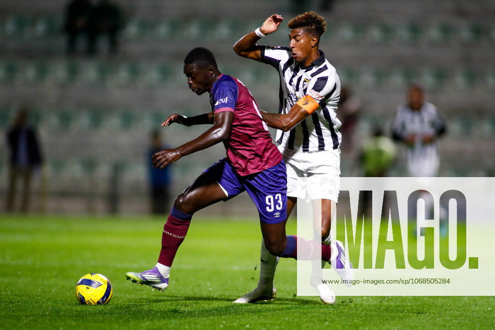 Liga Portugal 2: Portimonense - Torreense Portimao, Portugal - 30 10 2025: Liga Portugal 2 Meu Super 9th round match between SC Portimonense and SCU Torreense at Estadio Municipal de Portimao 93 Torreense attacker, Mohamed Ali Diade shields the ball from 9 Portimonense attacker, Tamble Ulisses Folgado Monteiro Mandatory Credit: Toby Tande Avant Sports Agency Portimao Estadio Municipal de Portimao Portugal