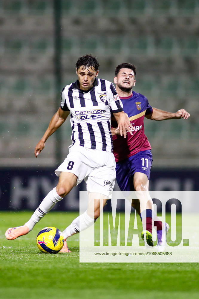 Liga Portugal 2: Portimonense - Torreense Portimao, Portugal - 30 10 2025: Liga Portugal 2 Meu Super 9th round match between SC Portimonense and SCU Torreense at Estadio Municipal de Portimao 8 Portimonense midfielder, Samuel Lobato passes the ball forward ahead of 11 Torreense attacker, Manu Pozo Mandatory Credit: Toby Tande Avant Sports Agency Portimao Estadio Municipal de Portimao Portugal