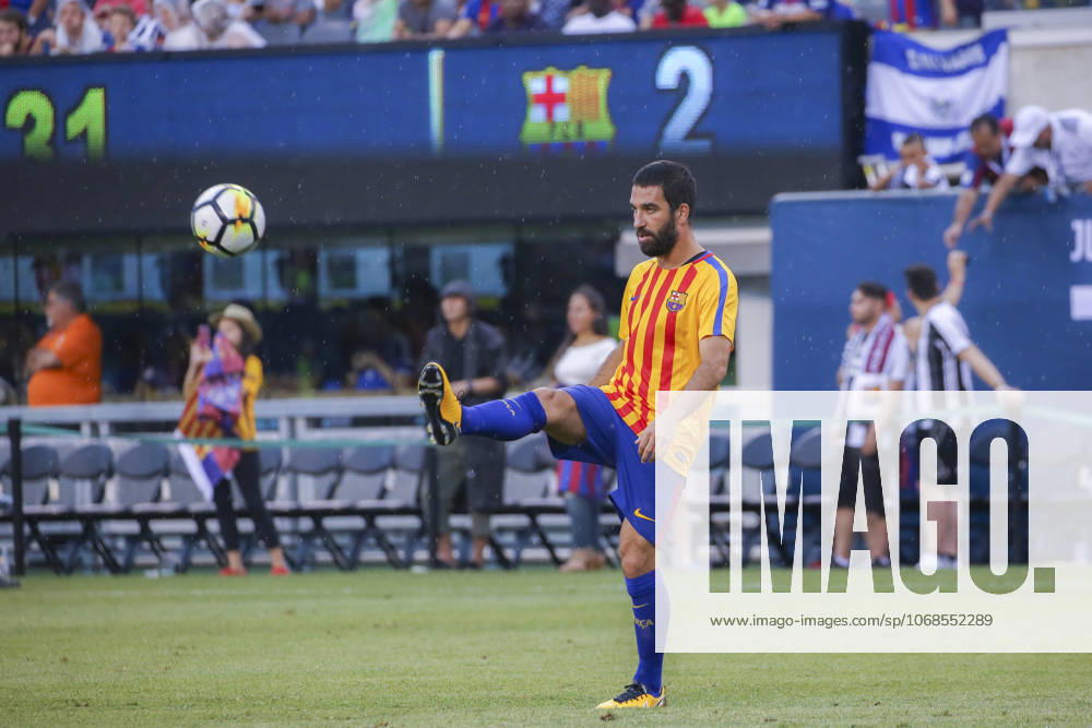 Juventus vs Barcelona : 2017 International Champions Cup RUTHERFORD, USA - JULY 22: Arda Turan of Barcelona warms up ahead of the International Champions Cup 2017 friendly match between Juventus and Barcelona at Metlife Stadium in Rutherford, New Jersey, United States on July 22, 2017. New Jersey United States. Editorial use only. Please get in touch for any other usage.