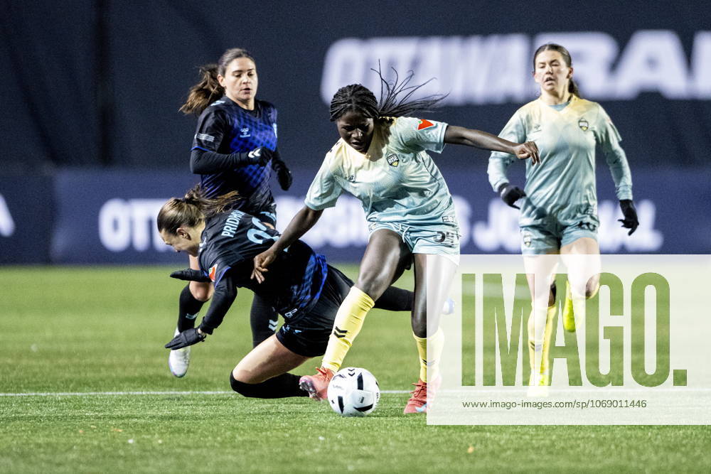 Vancouver Rise s Bridget Mutipula (centre) fights off Ottawa Rapid s Delaney Baie Pridham (left) during second half Northern Super League semifinal soccer action in Ottawa, on Saturday, Nov. 8, 2025. Ottawa Canada - ZUMAc35_ 20251108_zaf_c35_090