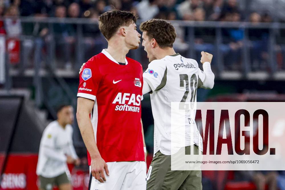 Guus Til of PSV Eindhoven celebrates after scoring his teams second goal and Wouter Goes of AZ Alkmaar looks dejected after conceding his sides second goal AZ Alkmaar v PSV Eindhoven, Eredivisie, AZ v PSV, AFAS-Stadium, November 9, 2025, Alkmaar, Netherlands.