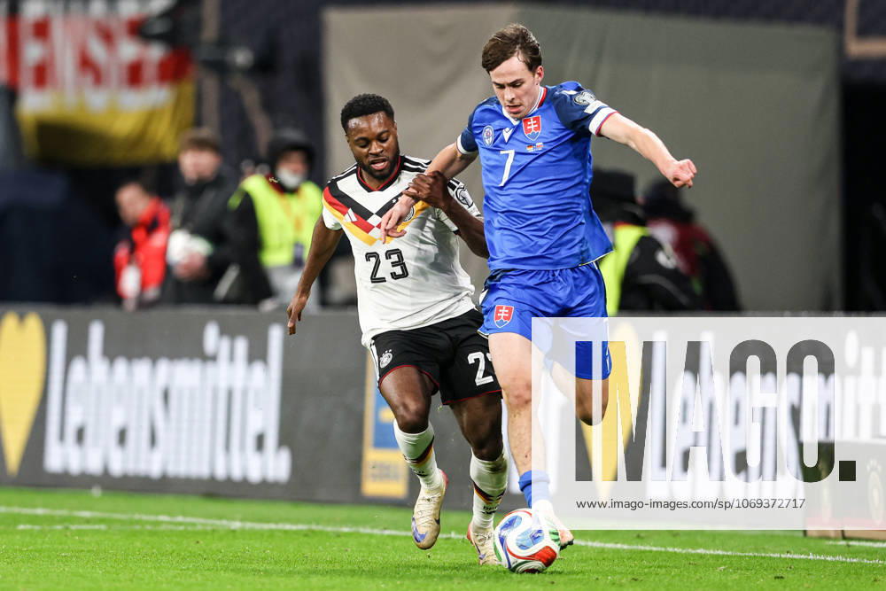 Ridle Baku of Germany (L) and Leo Sauer of Slovakia seen in action during European World Cup Qualifiers 2026 football match between Germany and Slovakia at RedBull (Leipzig). Final score Germany 6 : 0 Slovakia. Leipzig Germany - ZUMAs197 20251117_aaa_s197_345