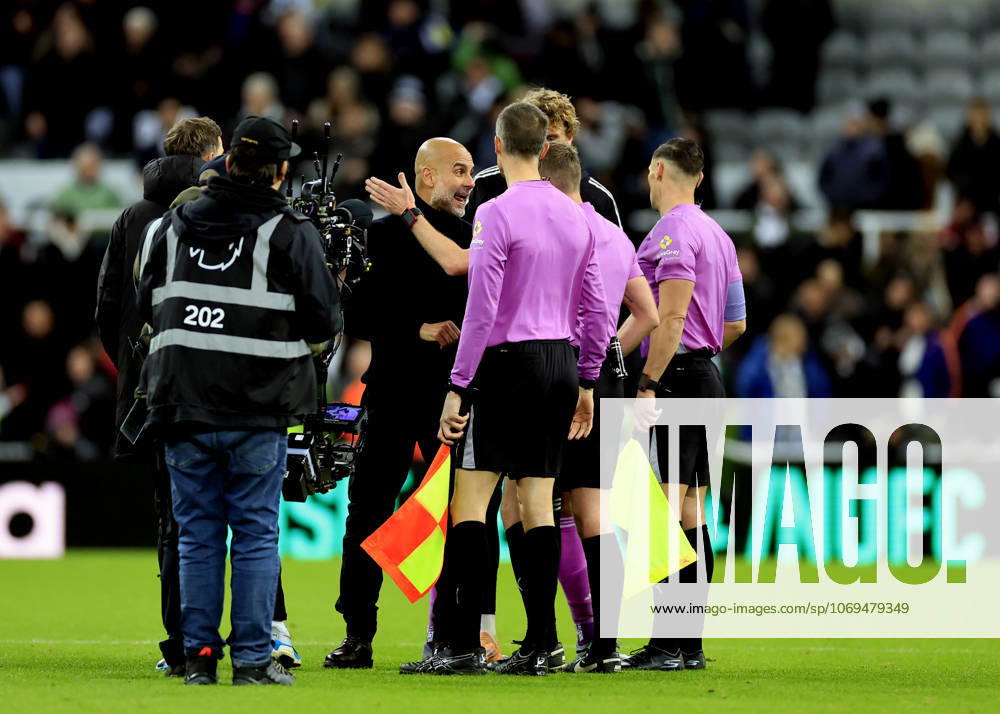 Newcastle United v Manchester City Premier League Pep Guardiola Manchester City Manager (middle) speaks with match officials at full time during the Premier League match at St. James s Park, Newcastle UK Newspapers OUT