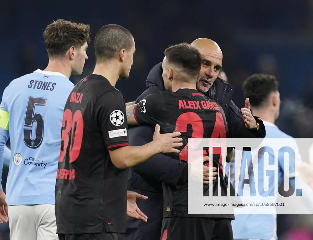 Manchester, England, 25th November 2025. Pep Guardiola coach of Manchester City congratulates Aleix Garcia of Bayer Leverkusen during the Manchester City vs Bayer Leverkusen UEFA Champions League match at the Etihad Stadium, Manchester. Picture credit should read: Andrew Yates Sportimage . SPI_074_AY_Man_City_Leverkusen SPI-4309-0110