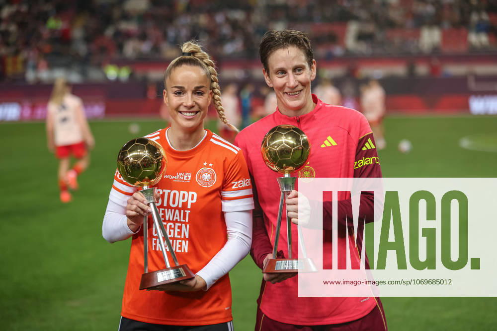 GER, Kaiserslautern, Germany vs Spain, international match, football, UEFA, 2025 2026 season, Womens Nations League, Fritz Walter Stadion, final, first leg in picture Giulia Gwinn Germany 7 and Ann Katrin Berger Germany 1 receive the trophy and award as Footballer of the Year DFB DFL REGULATIONS PROHIBIT ANY USE OF PHOTOGRAPHS AS IMAGE SEQUENCES AND OR QUASI VIDEO